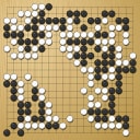 Board position at the end of game WAGC 2002 - Round 1 - Game 1: Paolo Montrasio vs Cristian Pop