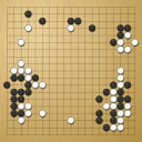 Board position at the end of game WAGC 2004 - Round 5 - Game 1: Bernard Helmstetter vs Kang-wuk Yi